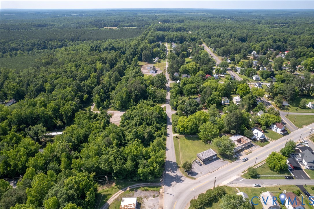0 Main Street Victoria, VA 23974 - Photo 4 of 5 an aerial view of a city with lots of residential buildings and mountain view in back