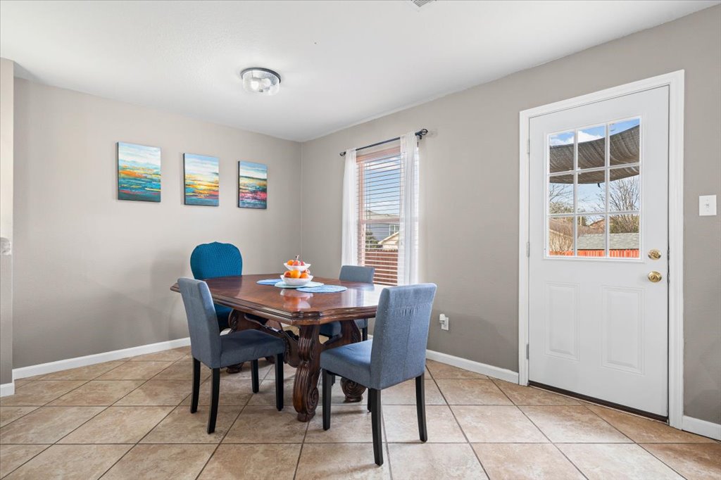 283 Black Forest Road Buda, TX 78610 - Photo 11 of 29 a view of a dining room with furniture and a window