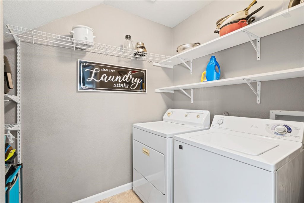 283 Black Forest Road Buda, TX 78610 - Photo 15 of 29 a utility room with dryer and washer
