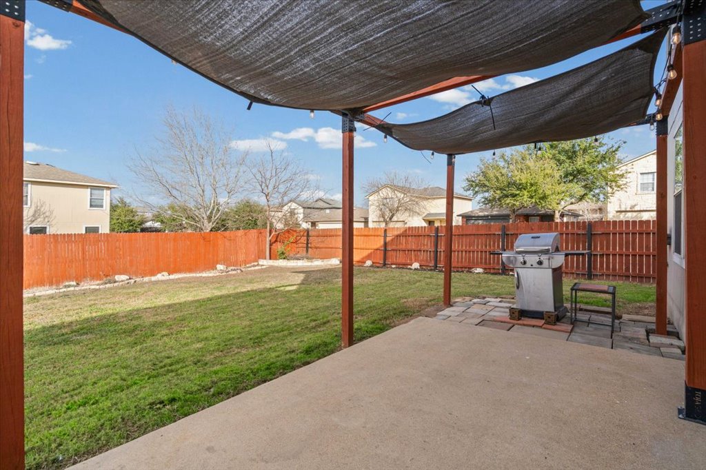 283 Black Forest Road Buda, TX 78610 - Photo 17 of 29 a view of a backyard with hardwood
