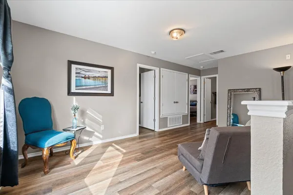 a bedroom with furniture and a window