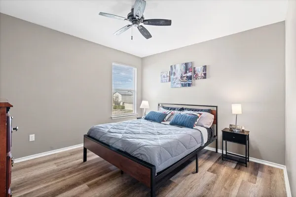 a bedroom with a bed and a table