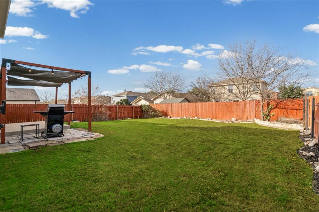 283 Black Forest Road Buda, TX 78610 - Photo 4 of 29 Fenced backyard featuring a patio area
