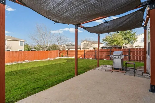 a view of backyard with green space