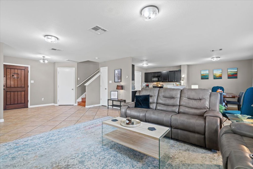 283 Black Forest Road Buda, TX 78610 - Photo 9 of 29 a living room with furniture and a wooden floor