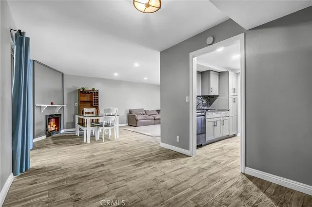 a view of kitchen with furniture and refrigerator