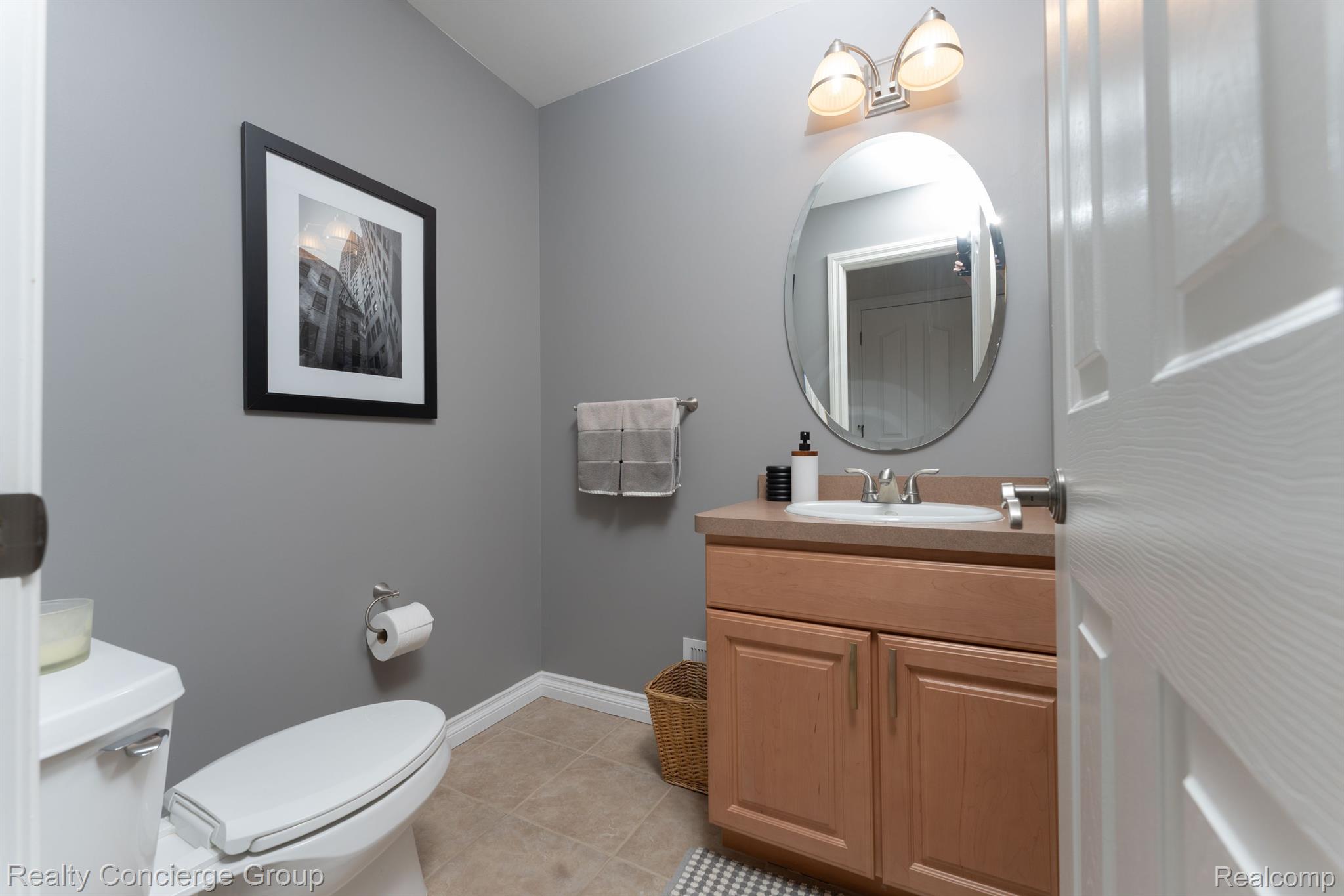 1172 Thorn Ridge Drive Howell, MI 48843 - Photo 23 of 71 Convenient 1/2 bath w/ vanity, tile flooring