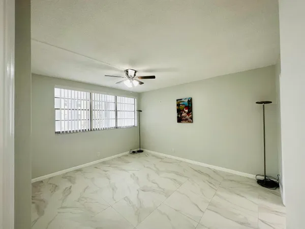 a view of an empty room with a window