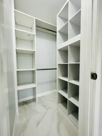 a view of an empty walk in closet