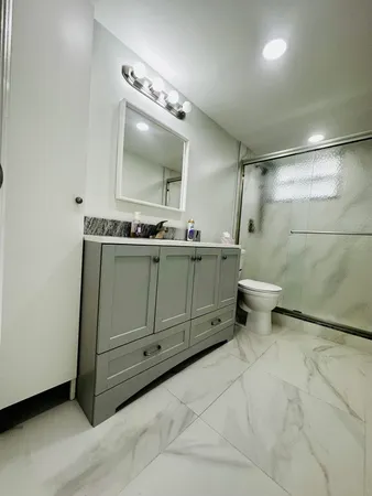 a bathroom with a sink and mirror