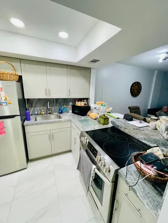 a kitchen with a stove and a sink