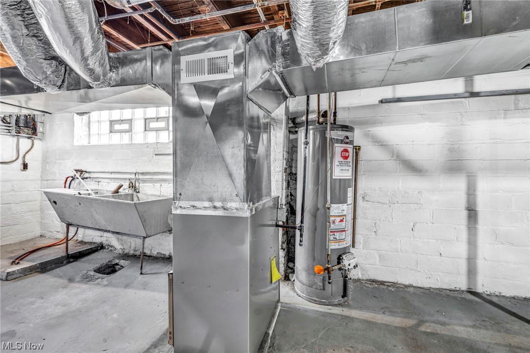 2563 Overlook Road Cleveland, OH 44106 - Photo 25 of 32 Utility room featuring sink and gas water heater