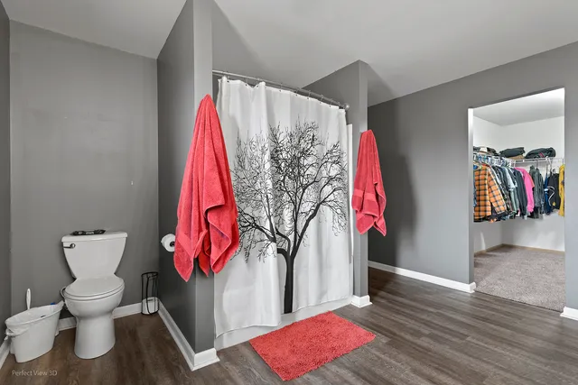 a view of a room with lots of stuff and hardwood floor