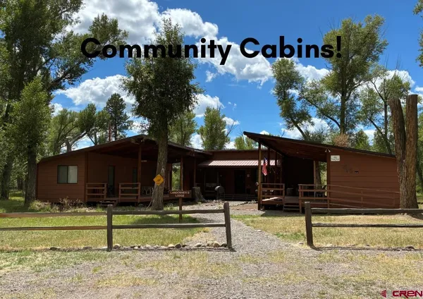 a view of house with a yard