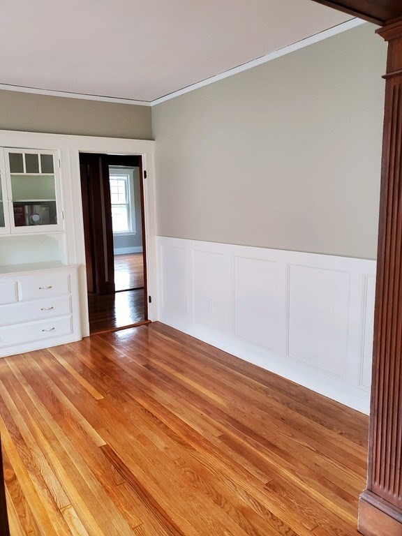 22 Allen Street, Unit 2 Arlington, MA 02474 - Photo 6 of 25 a view of empty room with wooden floor and fan