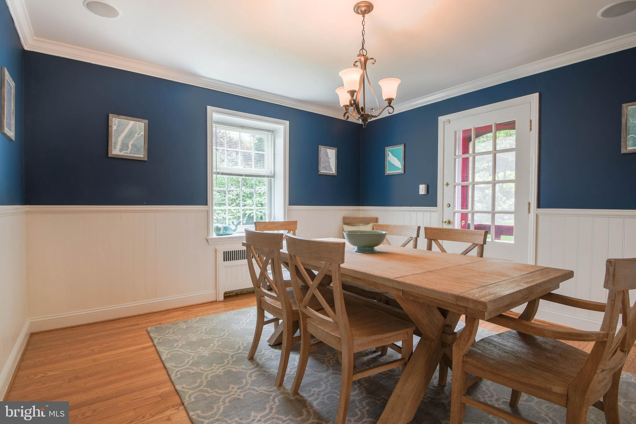5708 Kenmore Road Baltimore, MD 21210 - Photo 14 of 38 a view of a dining room with furniture window and chandelier