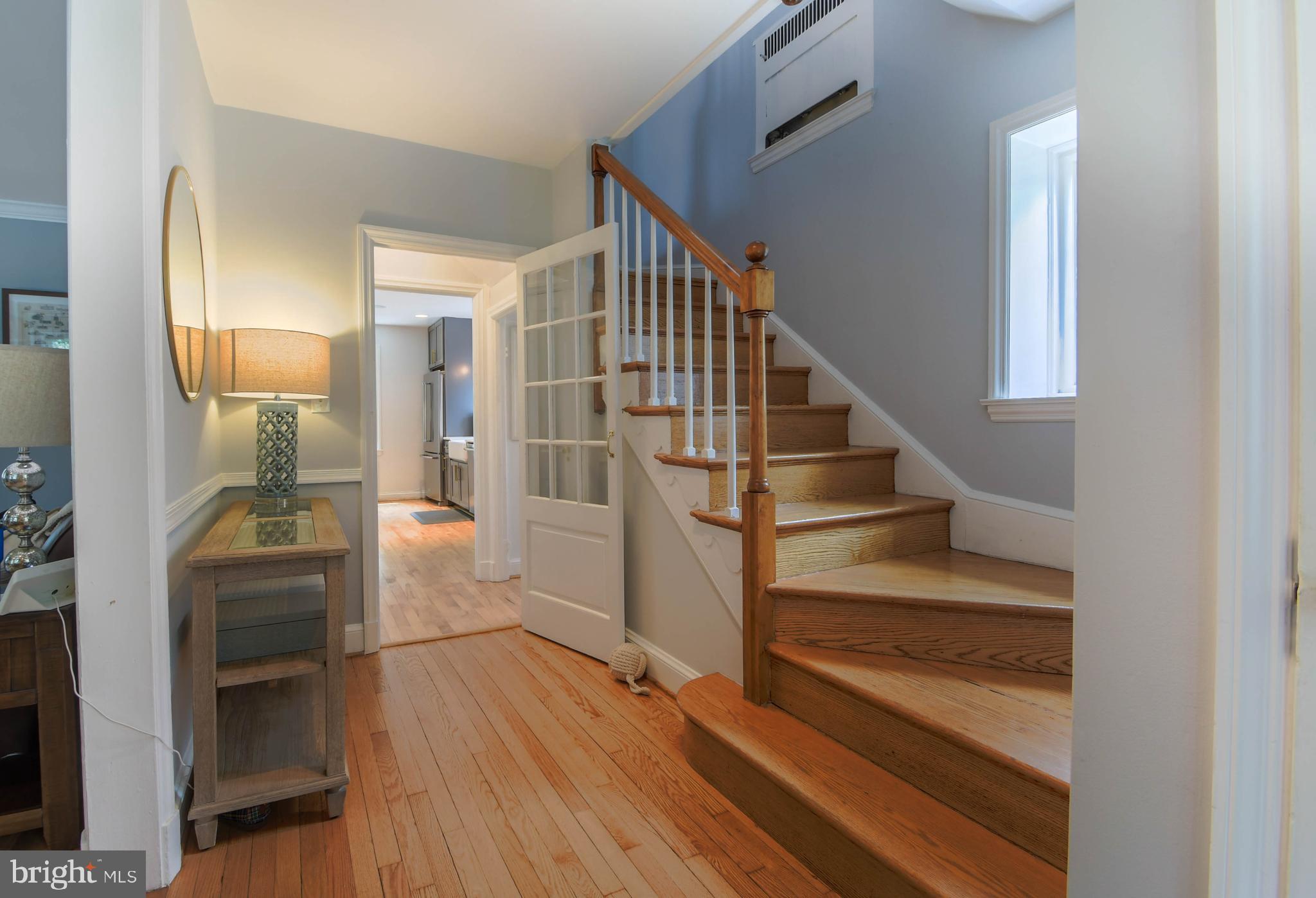 5708 Kenmore Road Baltimore, MD 21210 - Photo 3 of 38 a view of entryway and hall with wooden floor