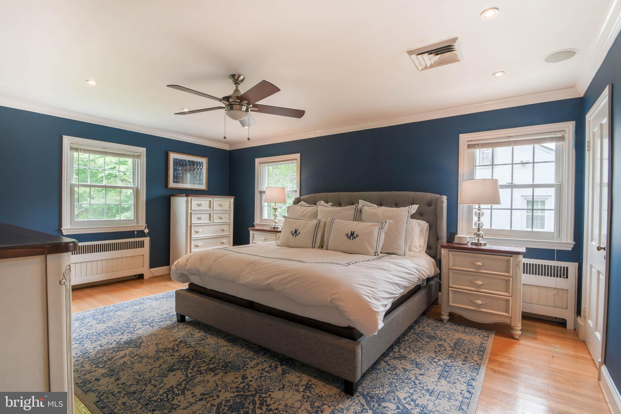 5708 Kenmore Road Baltimore, MD 21210 - Photo 22 of 38 a bedroom with a bed and a dresser next to a window