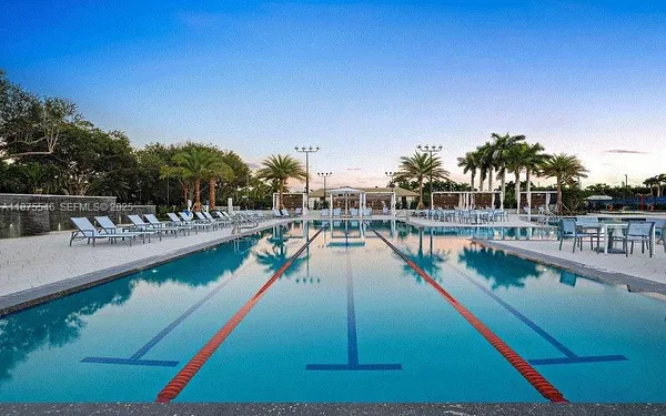 a view of a swimming pool with a lake view