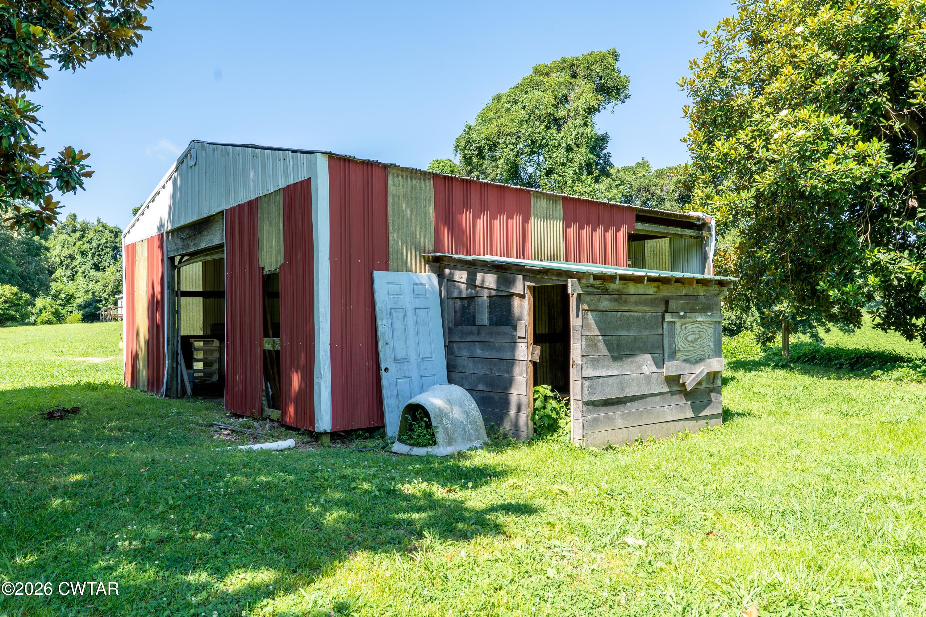 3454 Treece Road Hornbeak, TN 38232 - Photo 22 of 25 a view of a house with backyard and patio