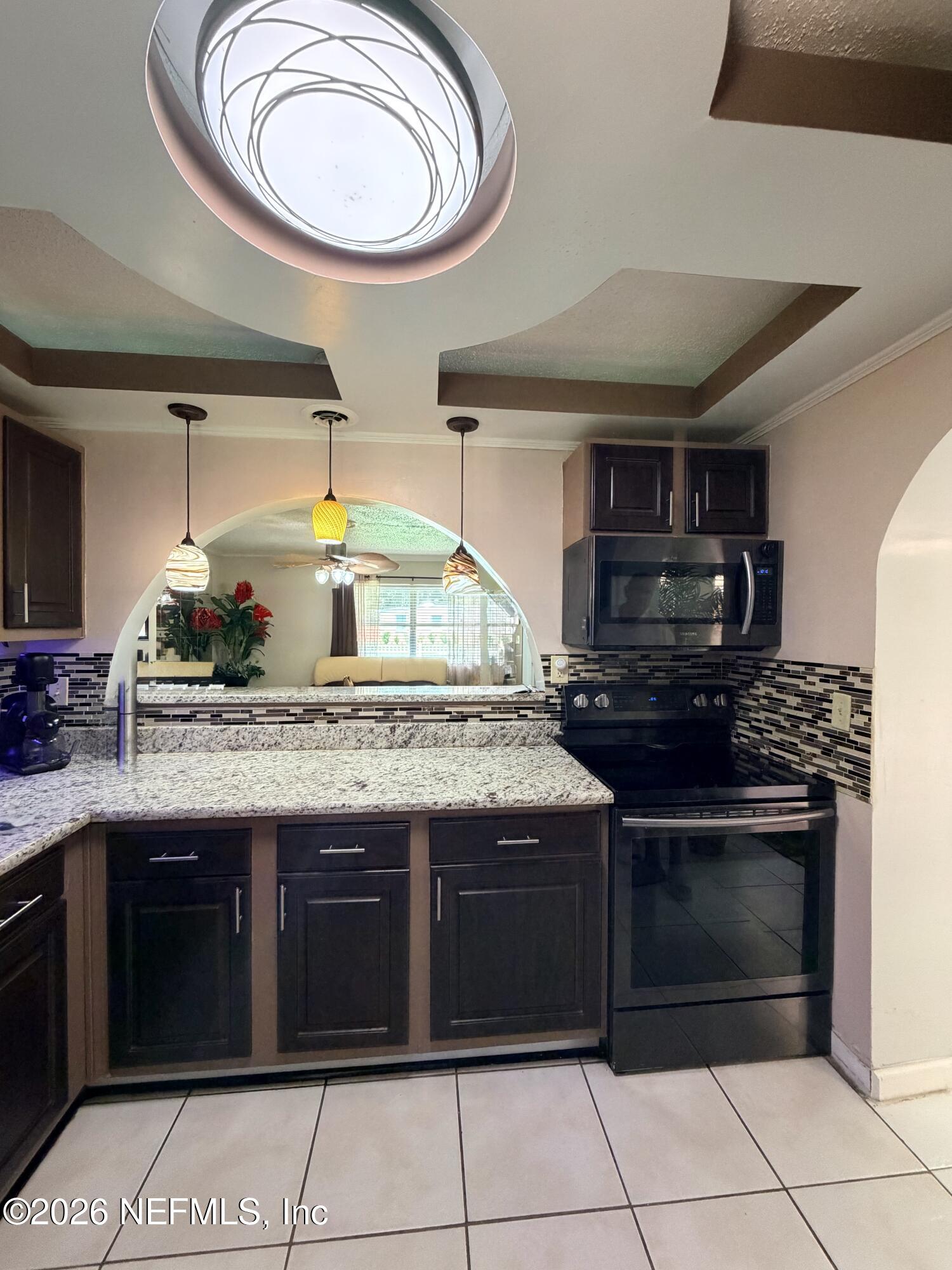 4127 Springwood Road Jacksonville, FL 32207 - Photo 10 of 63 a kitchen with a stove and a sink