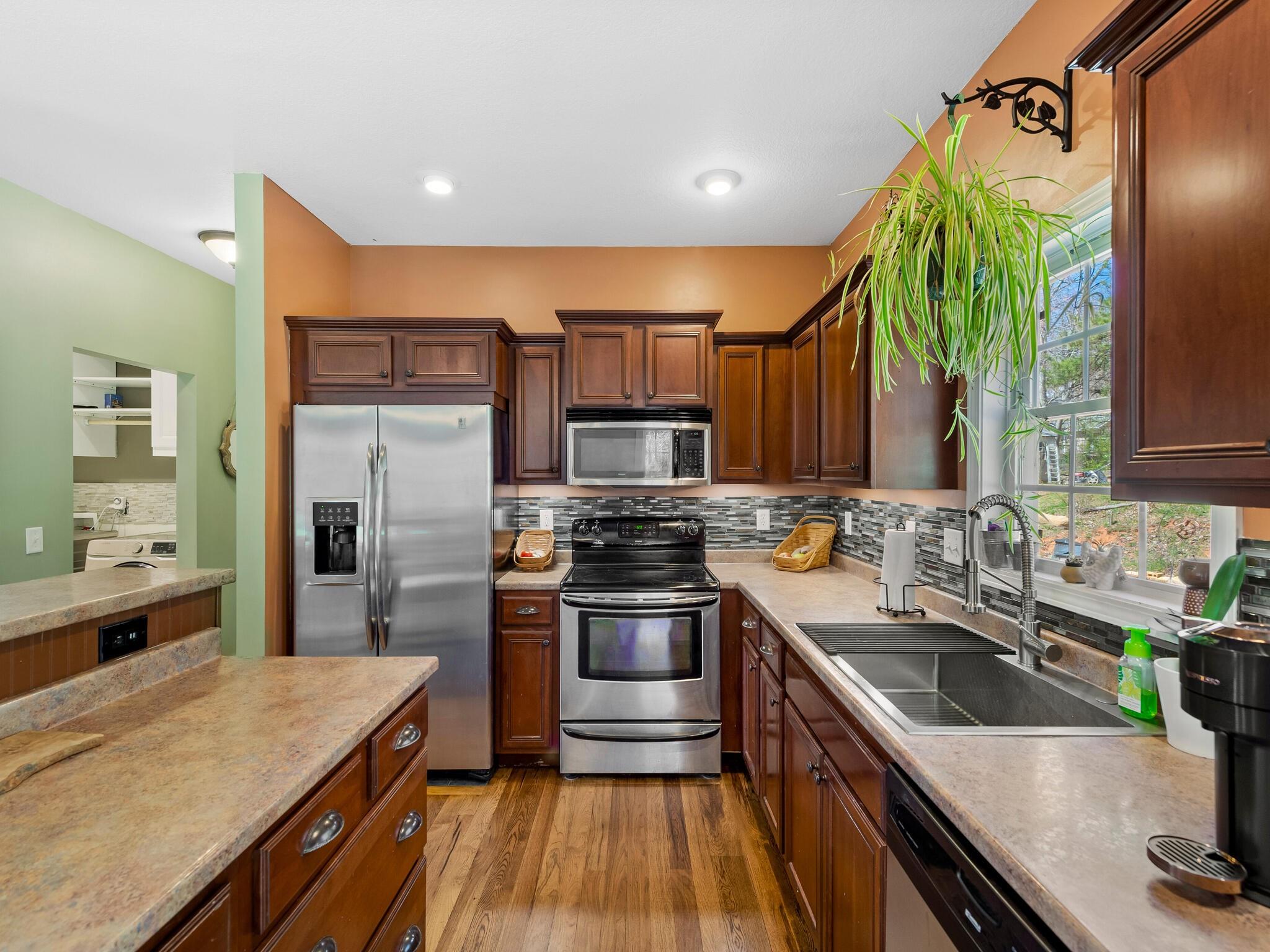 480 Meadowview Drive Saluda, NC 28773 - Photo 12 of 44 a kitchen with a sink and stainless steel appliances