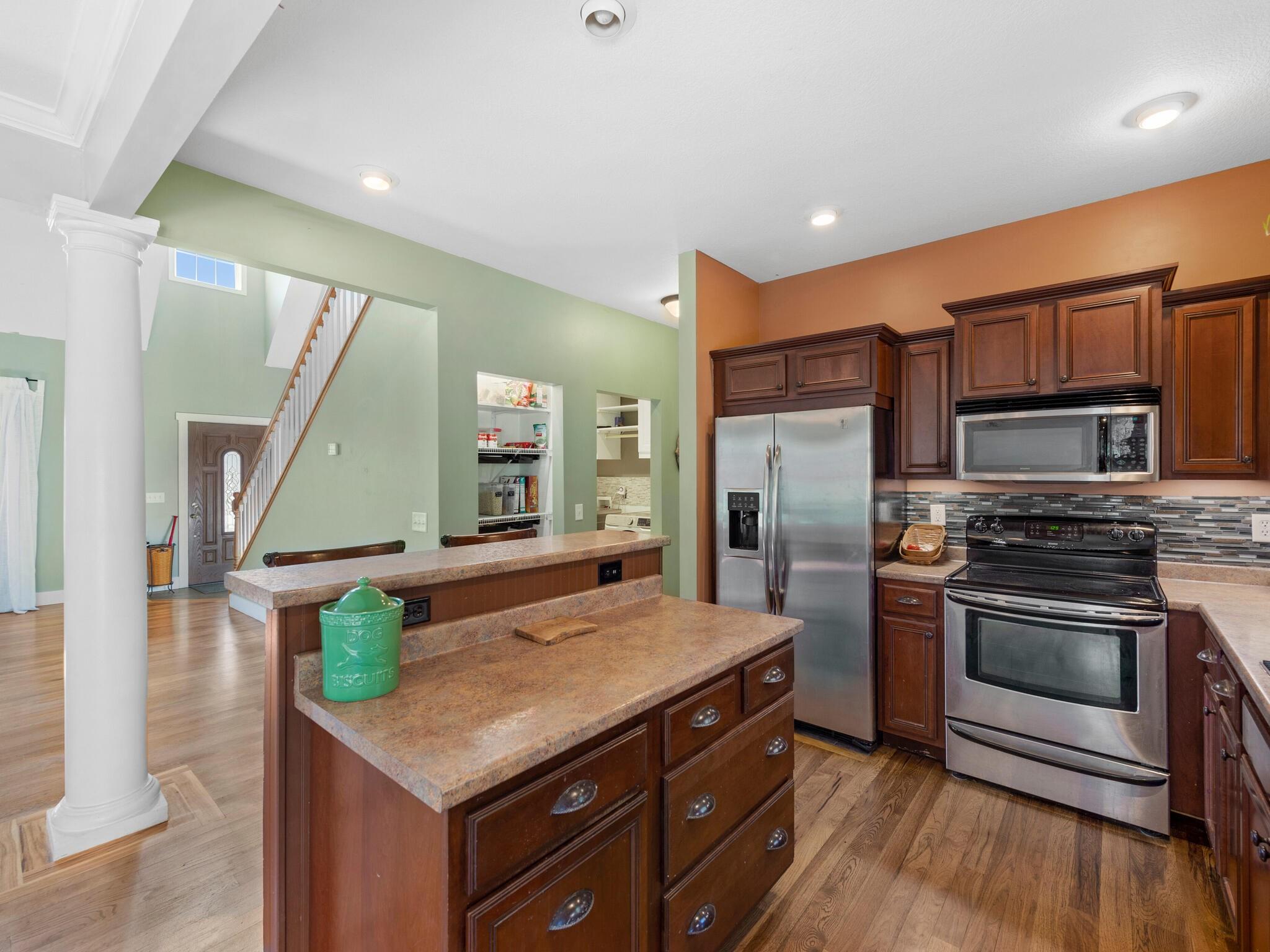 480 Meadowview Drive Saluda, NC 28773 - Photo 13 of 44 a kitchen with stainless steel appliances granite countertop a stove a sink and a refrigerator