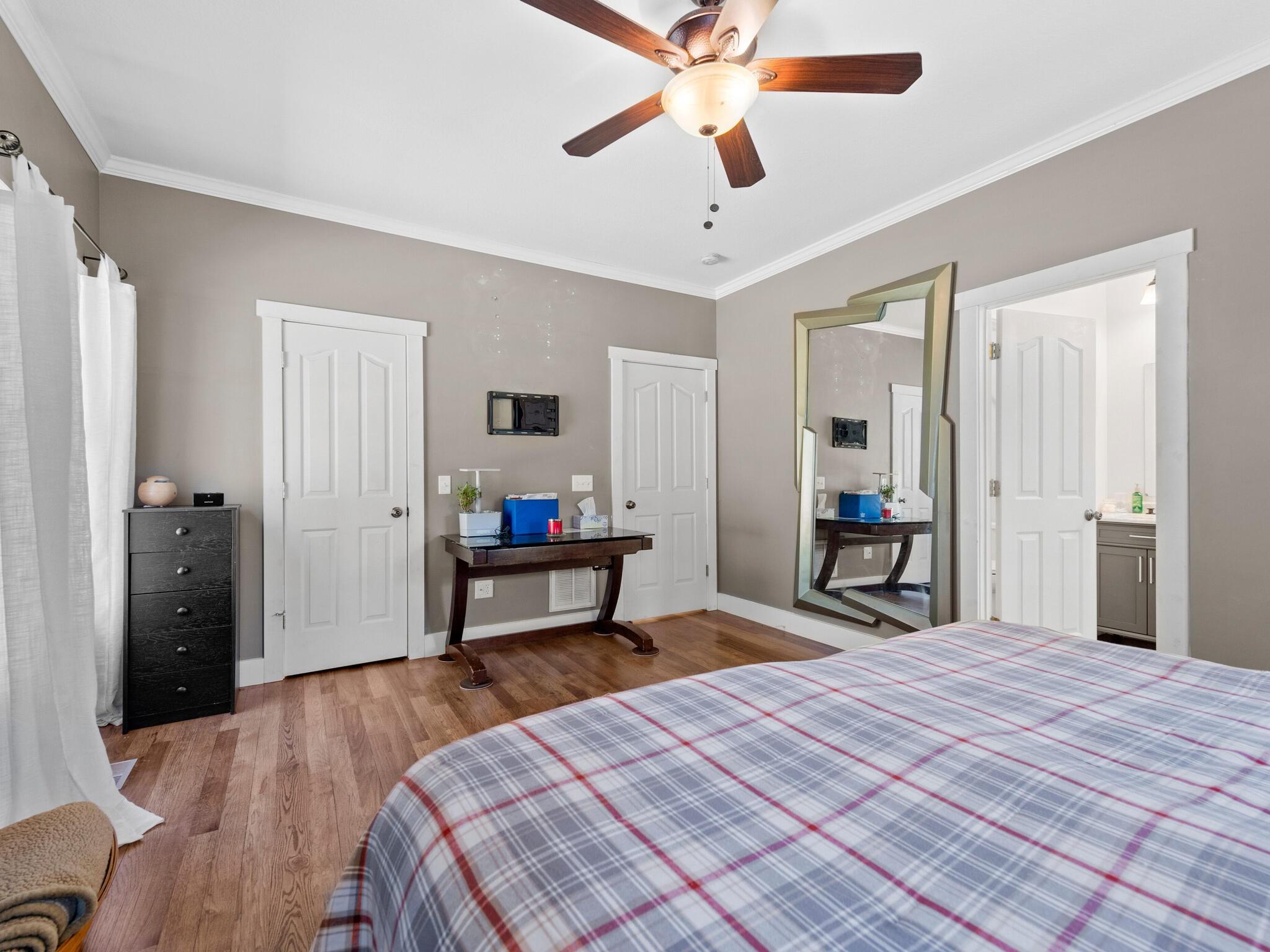 480 Meadowview Drive Saluda, NC 28773 - Photo 17 of 44 a bedroom with a bed and a chandelier