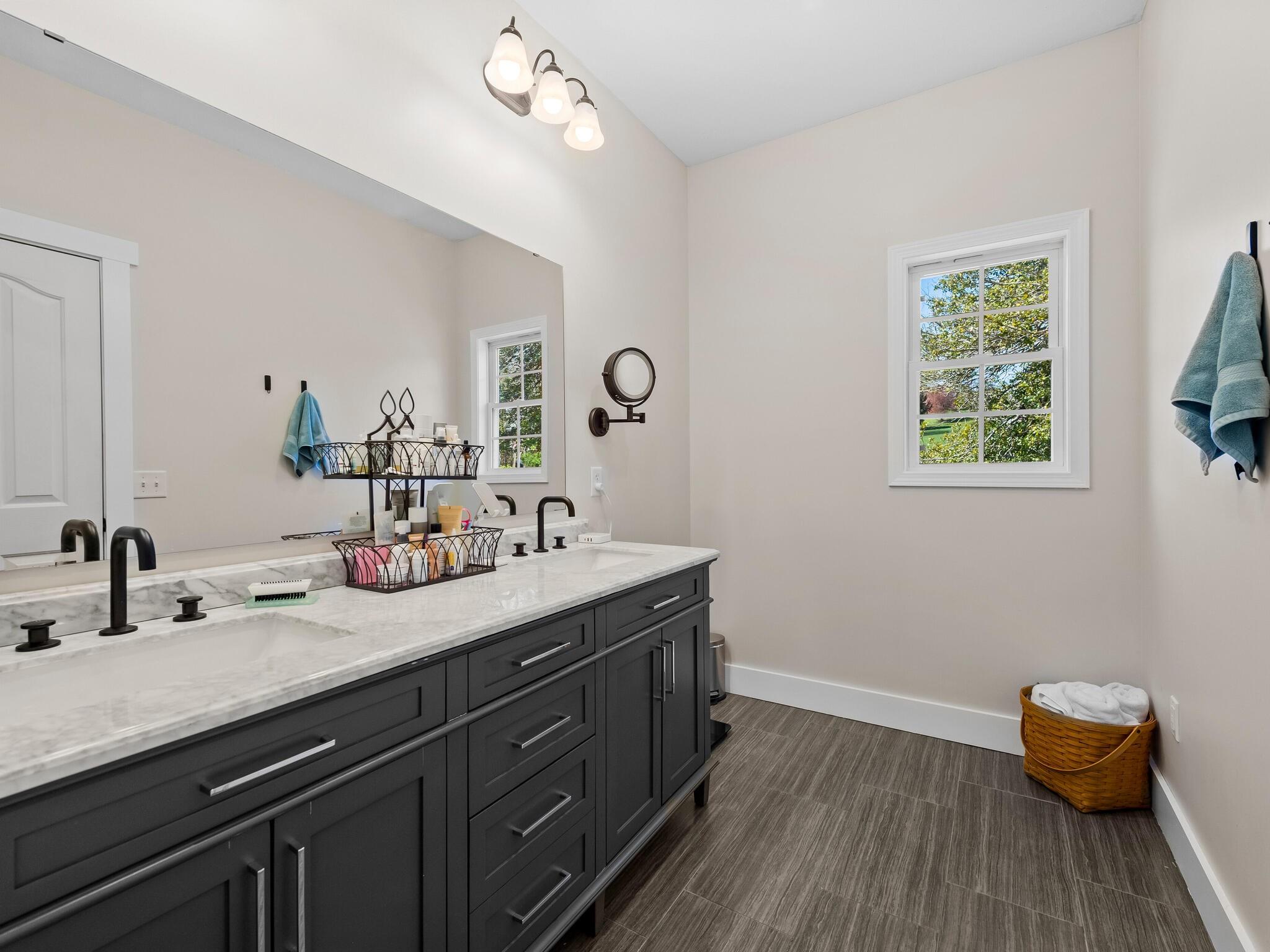 480 Meadowview Drive Saluda, NC 28773 - Photo 18 of 44 a bathroom with a sink double vanity and a window