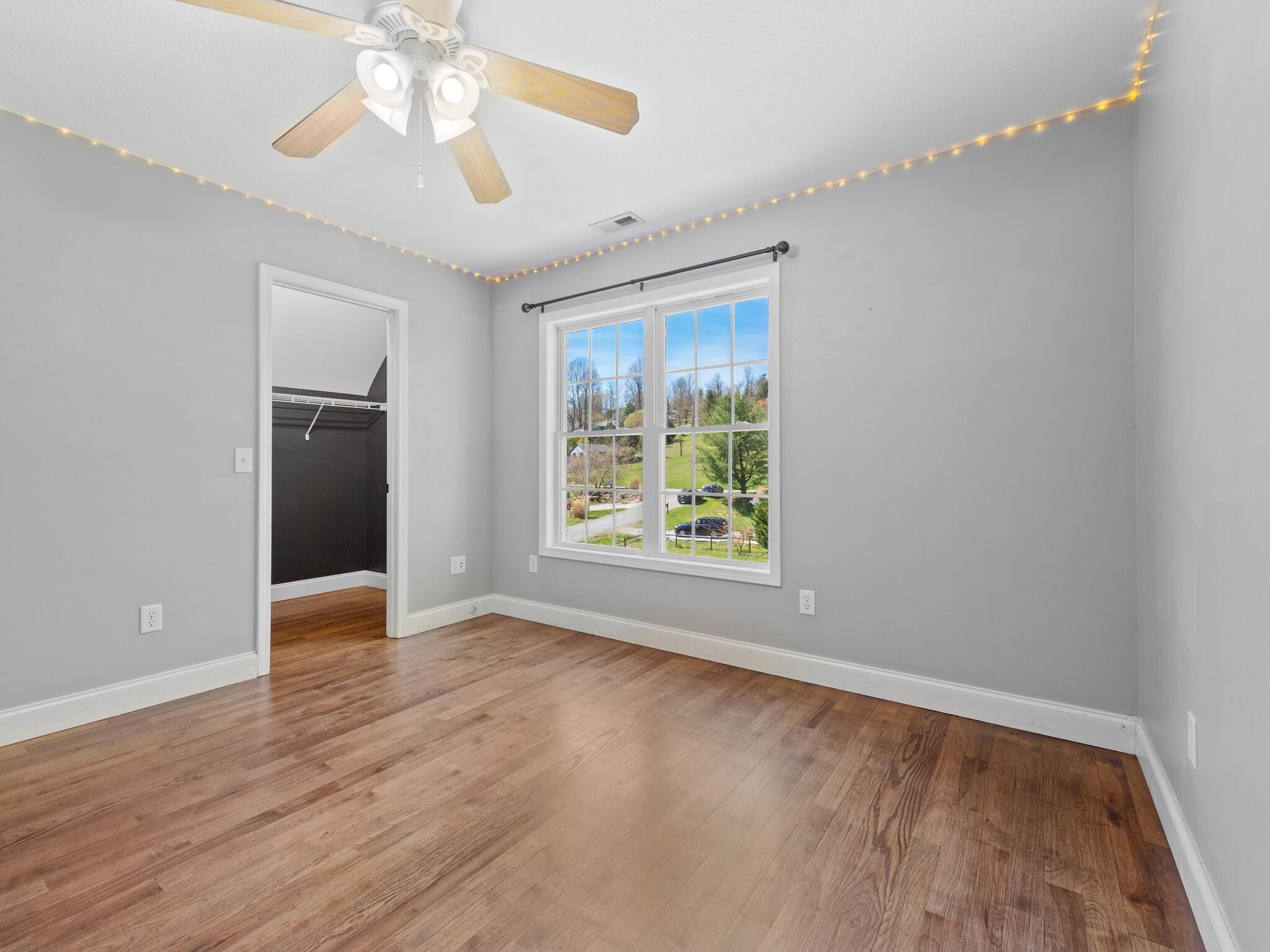 480 Meadowview Drive Saluda, NC 28773 - Photo 21 of 44 wooden floor in an empty room with a window