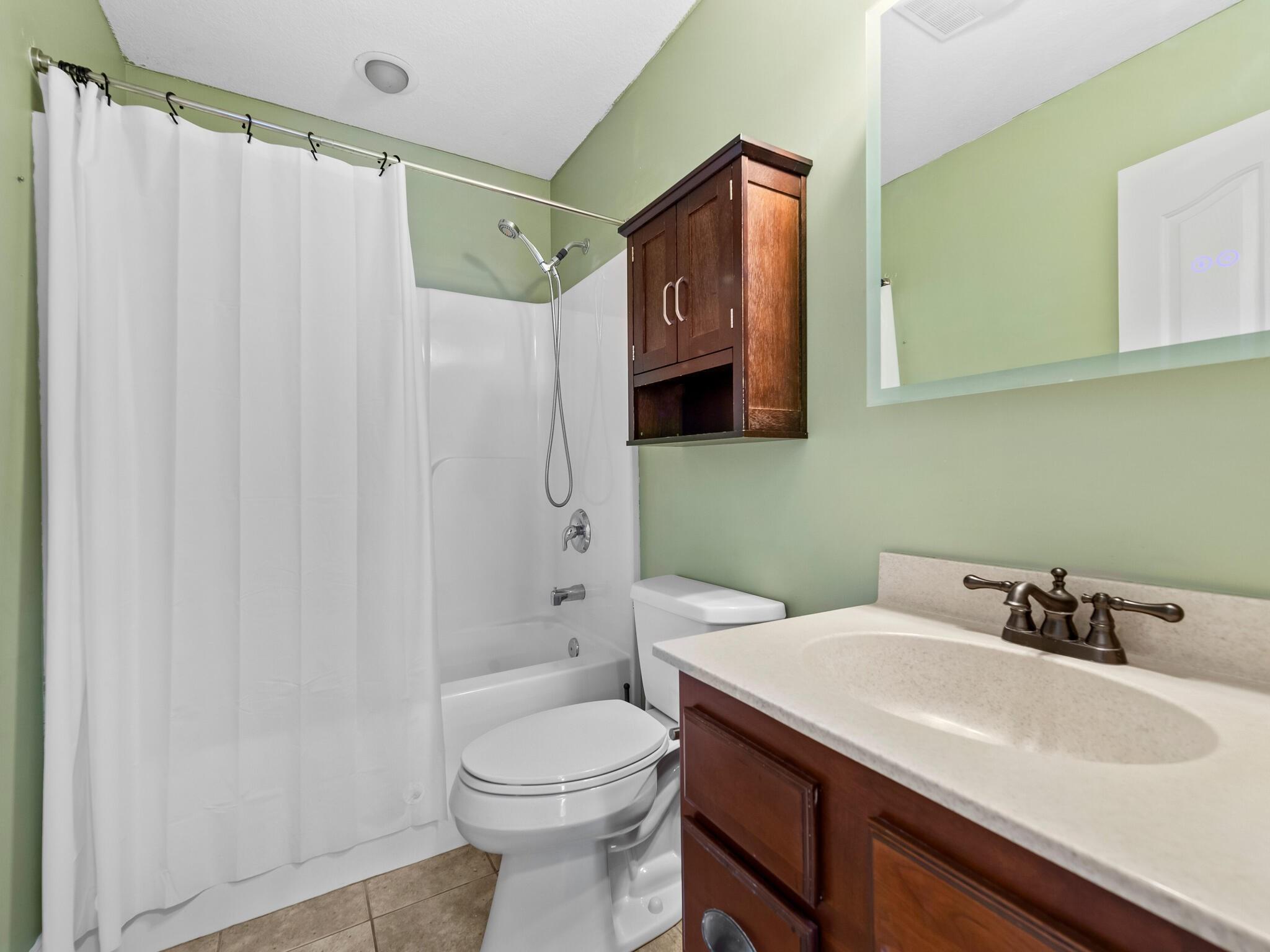 480 Meadowview Drive Saluda, NC 28773 - Photo 23 of 44 a bathroom with a sink a toilet and shower