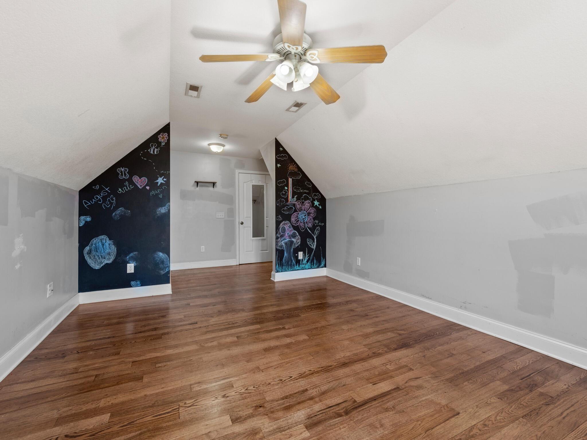 480 Meadowview Drive Saluda, NC 28773 - Photo 26 of 44 a view of an empty room with window and wooden floor