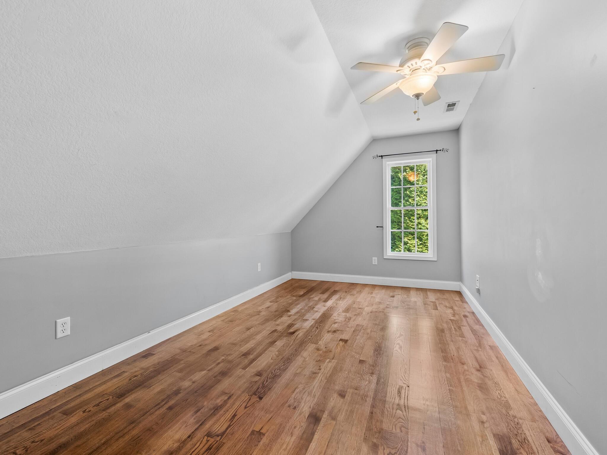 480 Meadowview Drive Saluda, NC 28773 - Photo 27 of 44 wooden floor in an empty room with a window