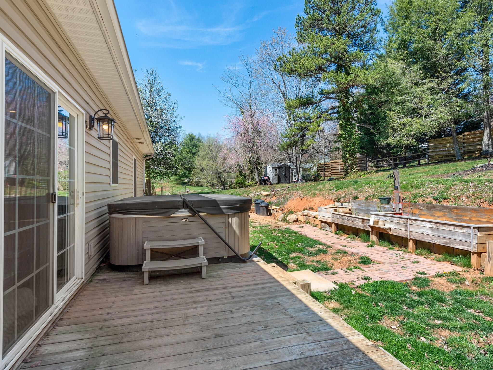 480 Meadowview Drive Saluda, NC 28773 - Photo 31 of 44 a view of backyard with deck and outdoor seating
