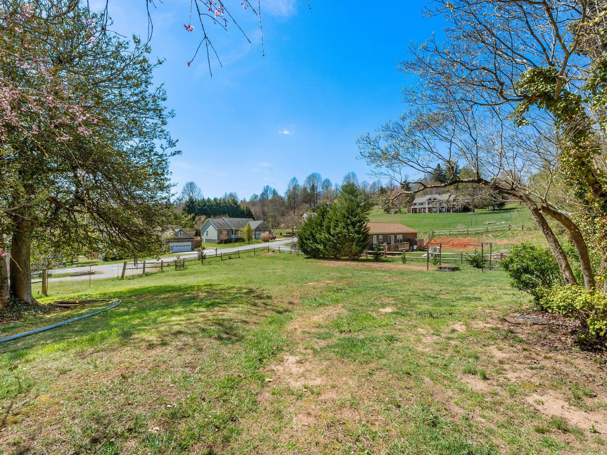 480 Meadowview Drive Saluda, NC 28773 - Photo 33 of 44 a view of a big yard with plants and large trees