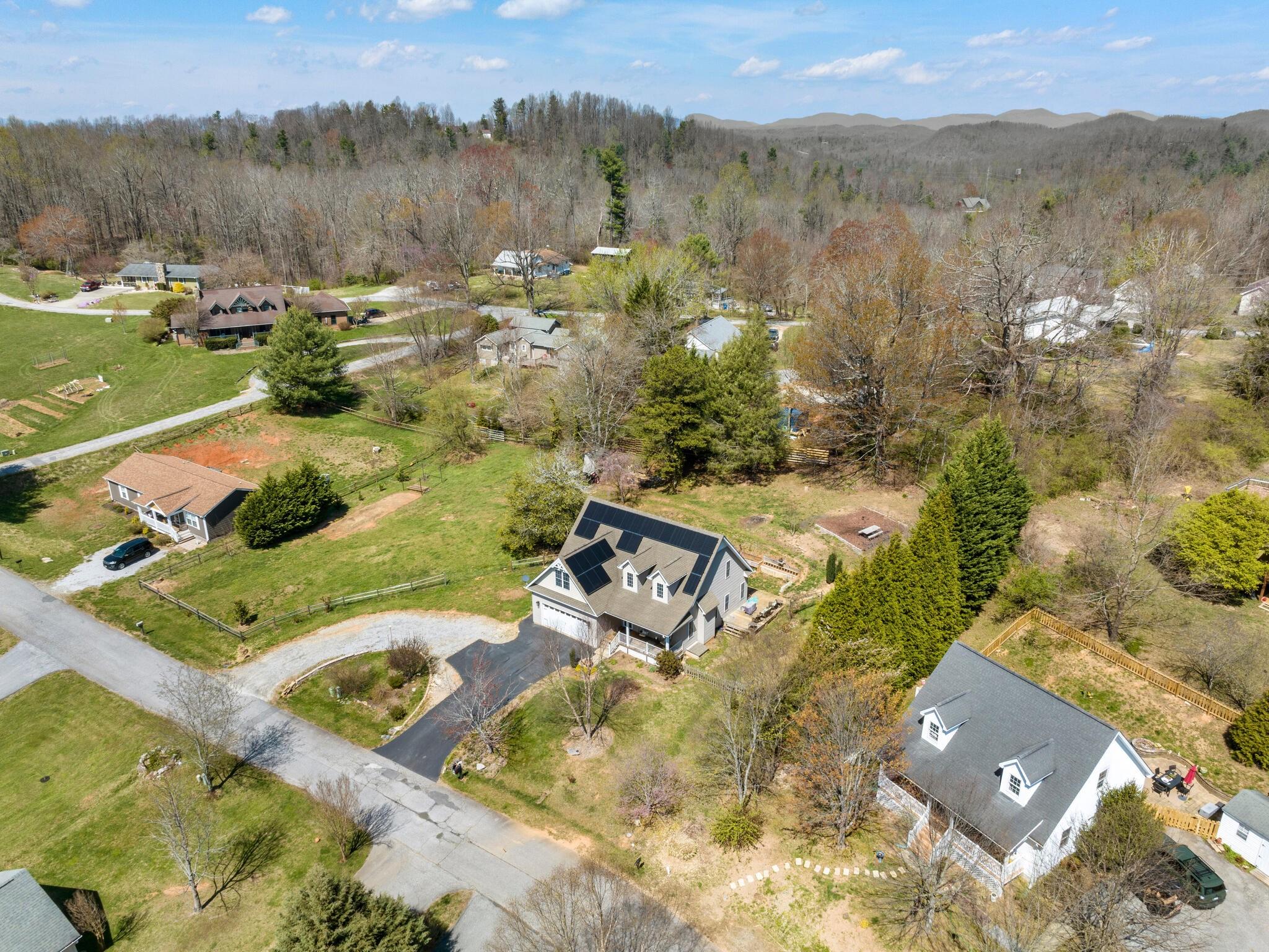 480 Meadowview Drive Saluda, NC 28773 - Photo 37 of 44 an aerial view of a house with a yard