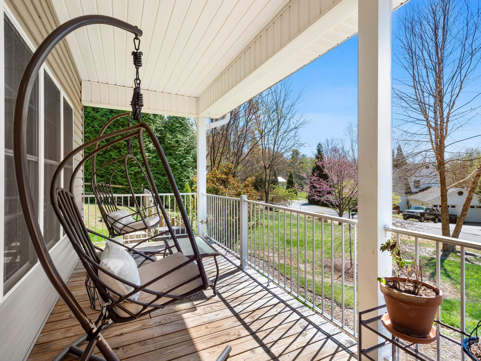 480 Meadowview Drive Saluda, NC 28773 - Photo 4 of 44 a view of a balcony with chairs