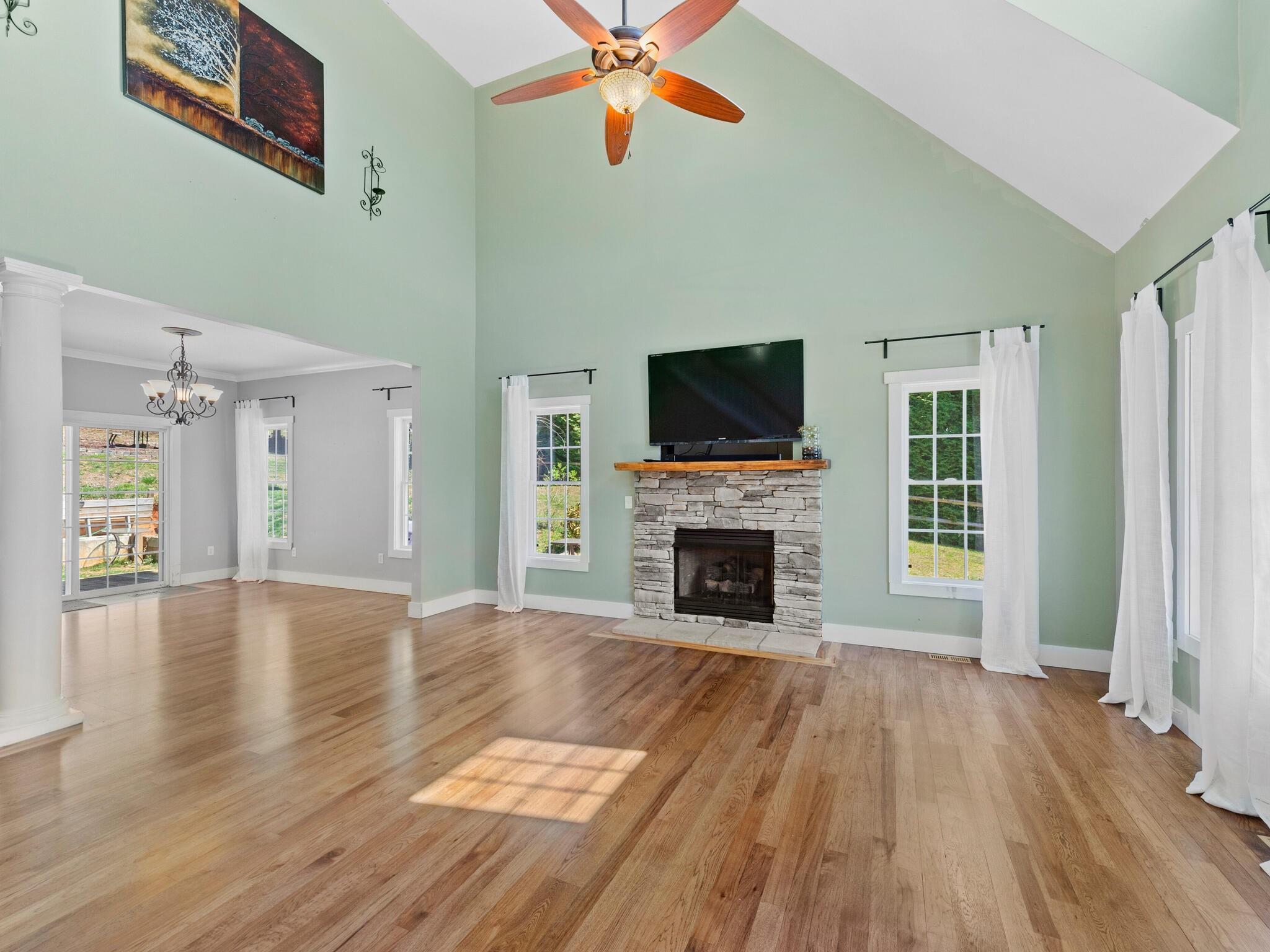 480 Meadowview Drive Saluda, NC 28773 - Photo 6 of 44 a view of empty room with a fireplace and wooden floor
