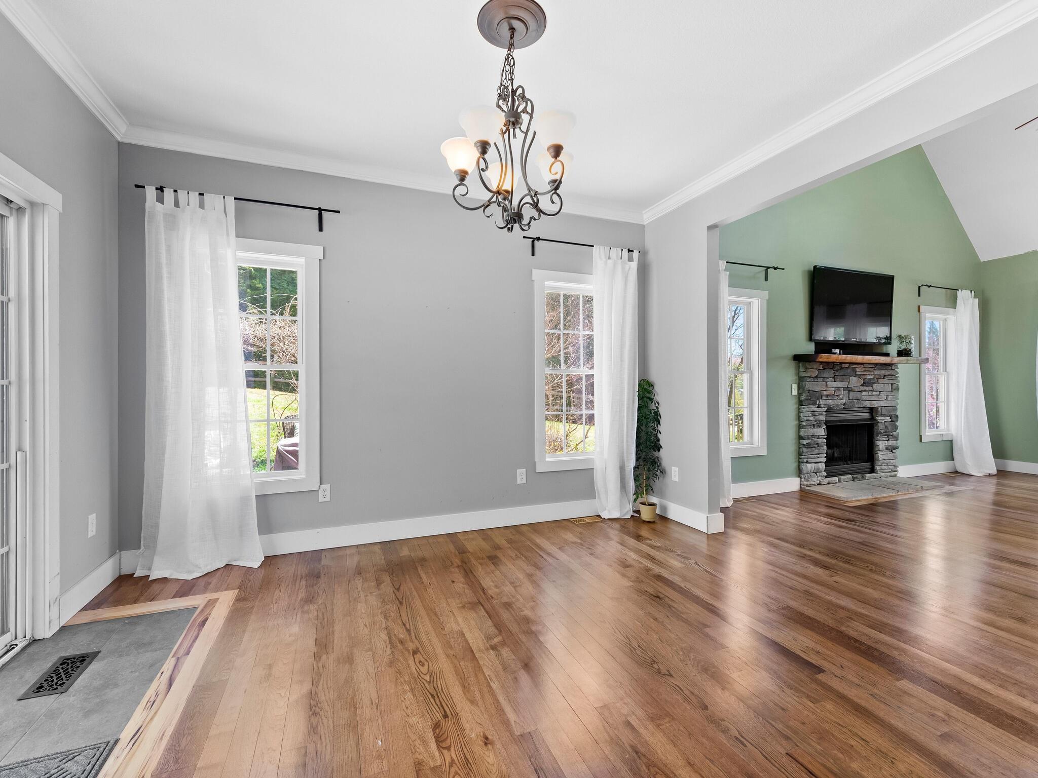 480 Meadowview Drive Saluda, NC 28773 - Photo 9 of 44 a view of an empty room with window and wooden floor