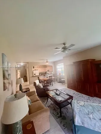 a living room with furniture and a table