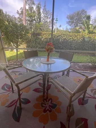 a view of a patio with a table chairs and a table