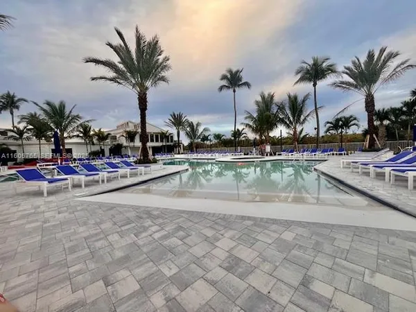 a view of swimming pool with outdoor seating