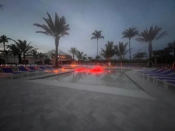 a view of outdoor space with palm trees