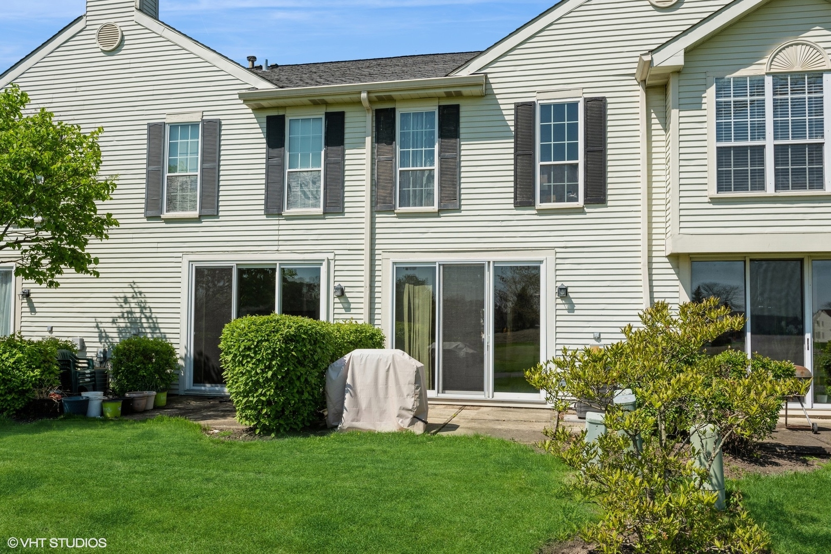 1475 Golfview Drive Glendale Heights, IL 60139 - Photo 15 of 17 a front view of a house with a yard and porch