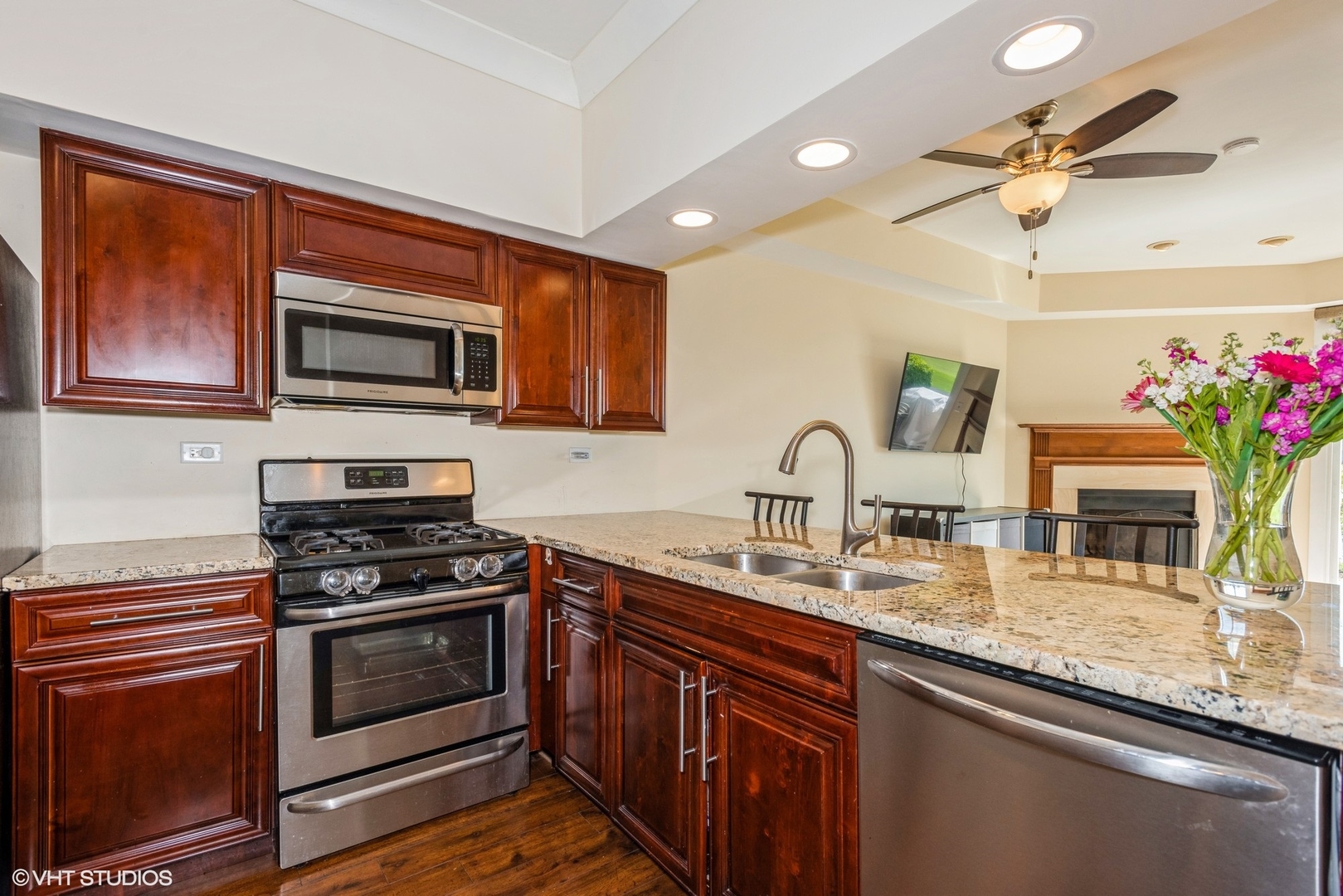 1475 Golfview Drive Glendale Heights, IL 60139 - Photo 4 of 17 a kitchen with granite countertop stainless steel appliances a stove sink and microwave