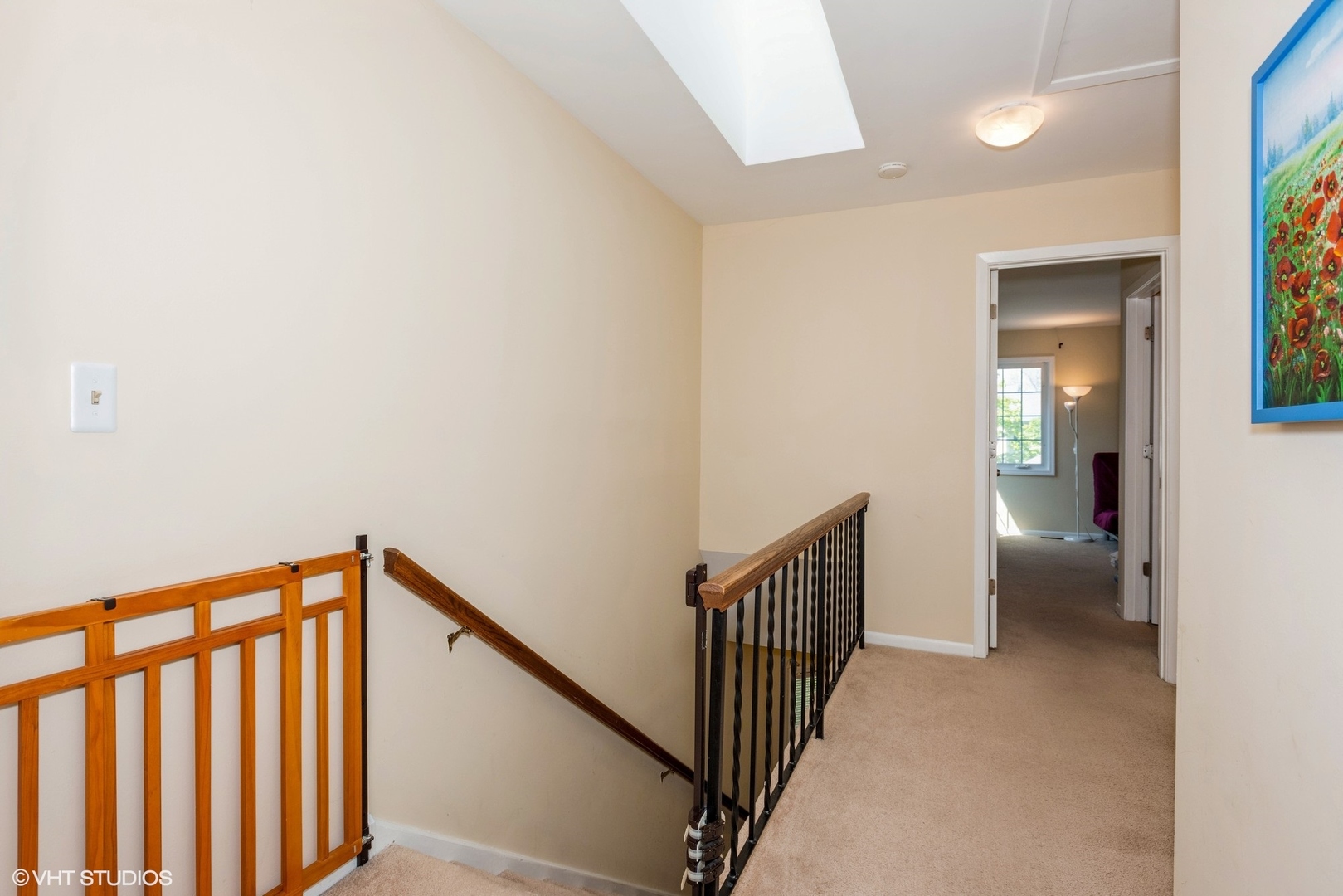 1475 Golfview Drive Glendale Heights, IL 60139 - Photo 9 of 17 a view of a hallway with wooden floor and a bathroom