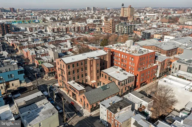 an aerial view of a house with a city view