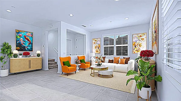 a living room with furniture and a potted plant