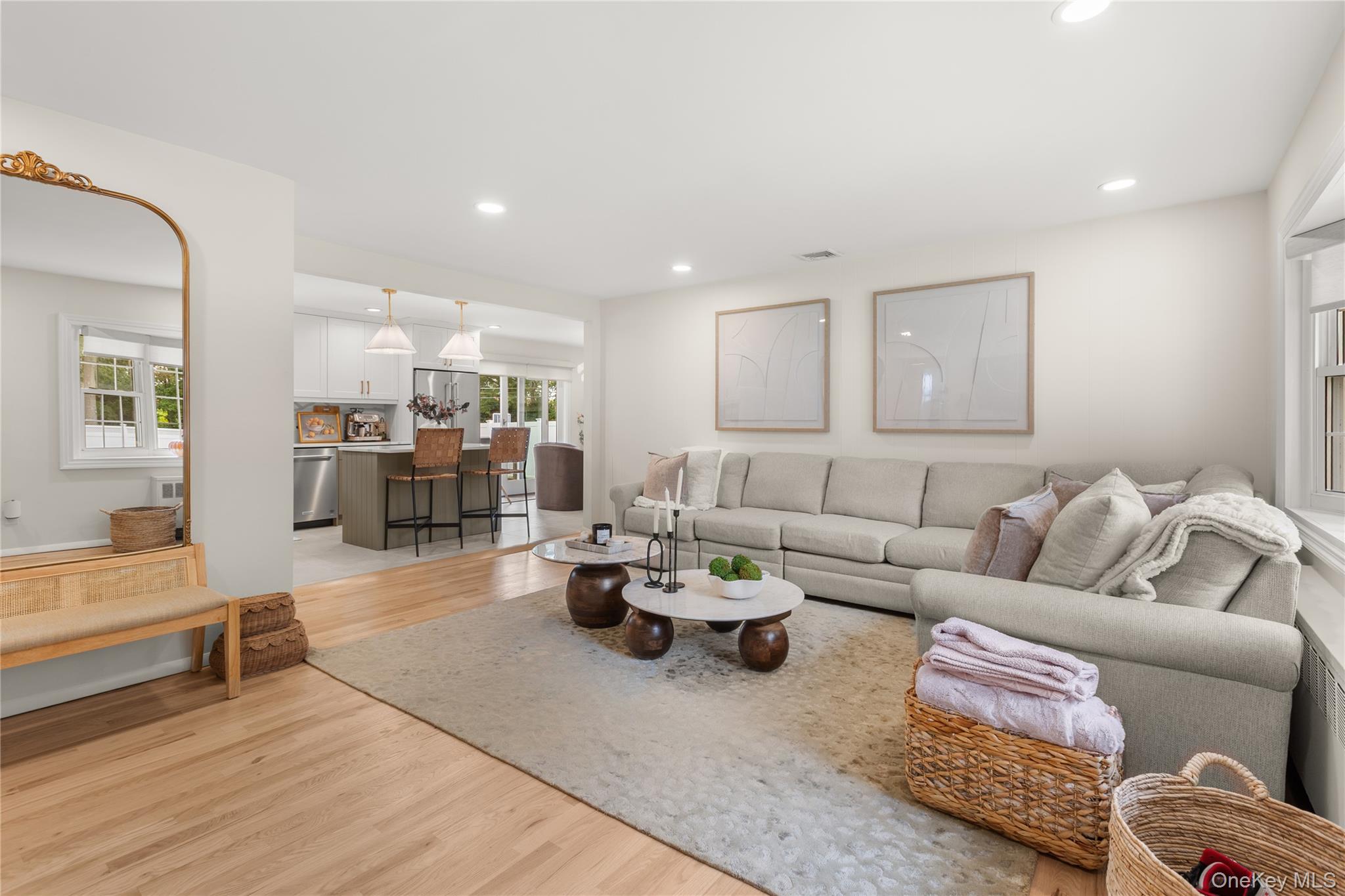 205 Timber Point Road East Islip, NY 11730 - Photo 2 of 16 Living room with light wood finished floors and recessed lighting