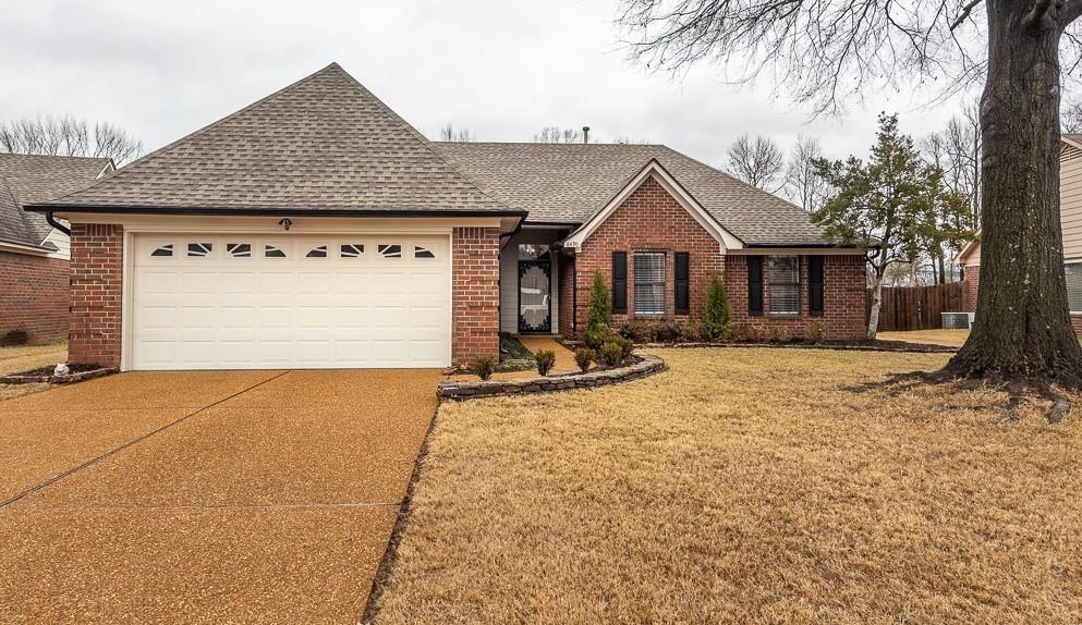 6490 Stone Lake Drive Bartlett, TN 38135 - Photo 1 of 32 a front view of a house with a yard